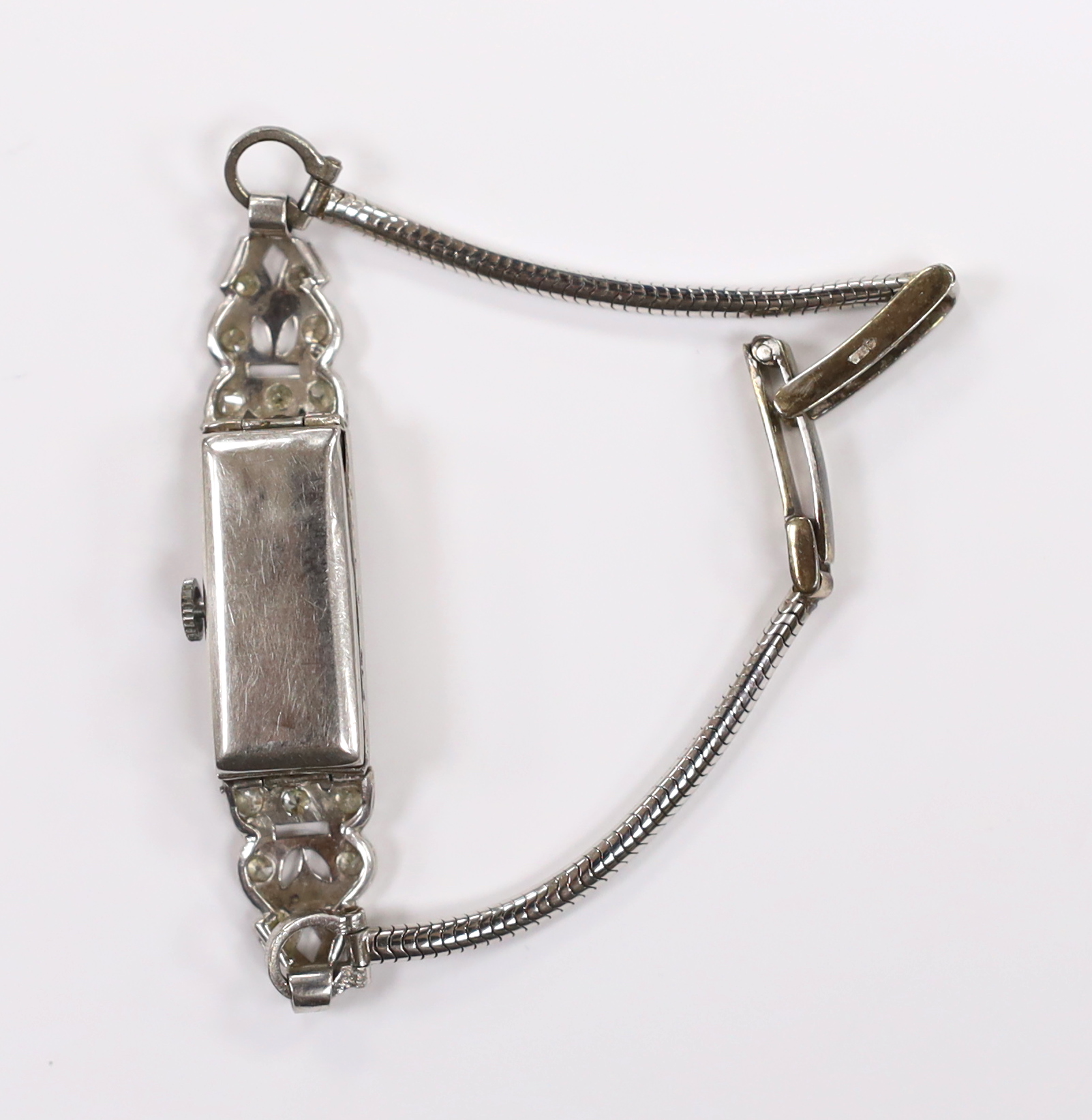 A lady's white metal stamped (All Platinum) and diamond cluster set manual wind cocktail watch, on a 9ct white gold bracelet, gross weight 14.3 grams.